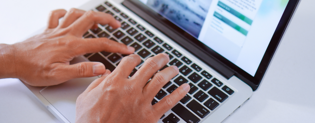 Image showing a person visiting an estate agent's website on a laptop